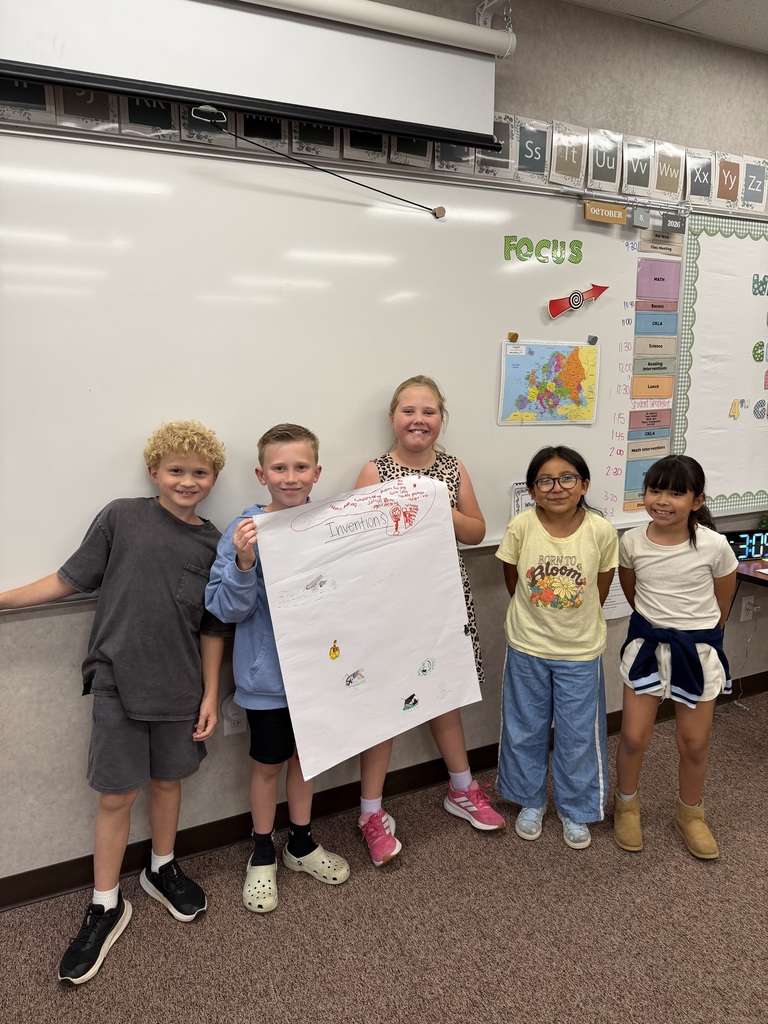 students holding a poster they created