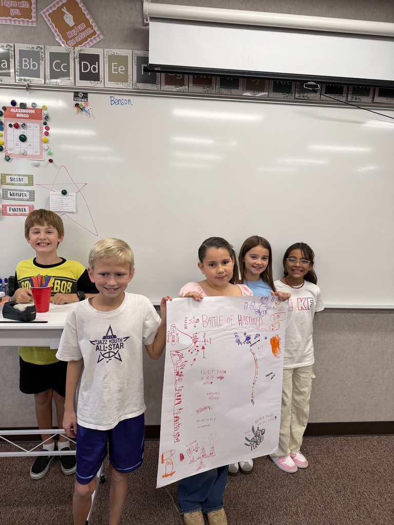 students holding a poster they created