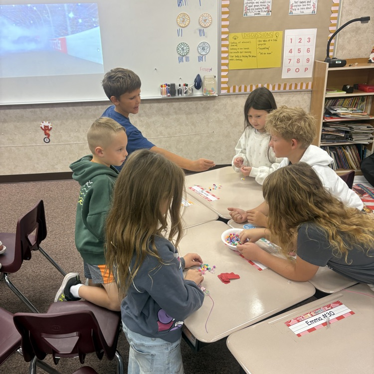 Mrs. Esplin’s class making friendship bracelets.