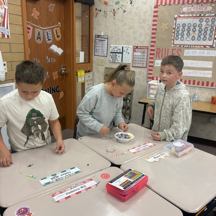 Mrs. Esplin’s class making friendship bracelets.
