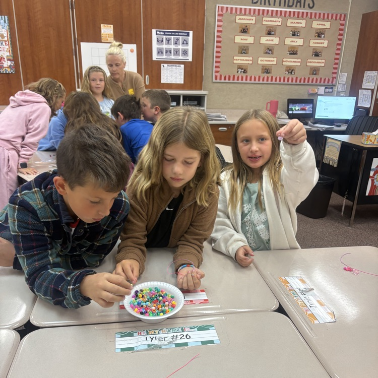 Mrs. Esplin’s class making friendship bracelets.