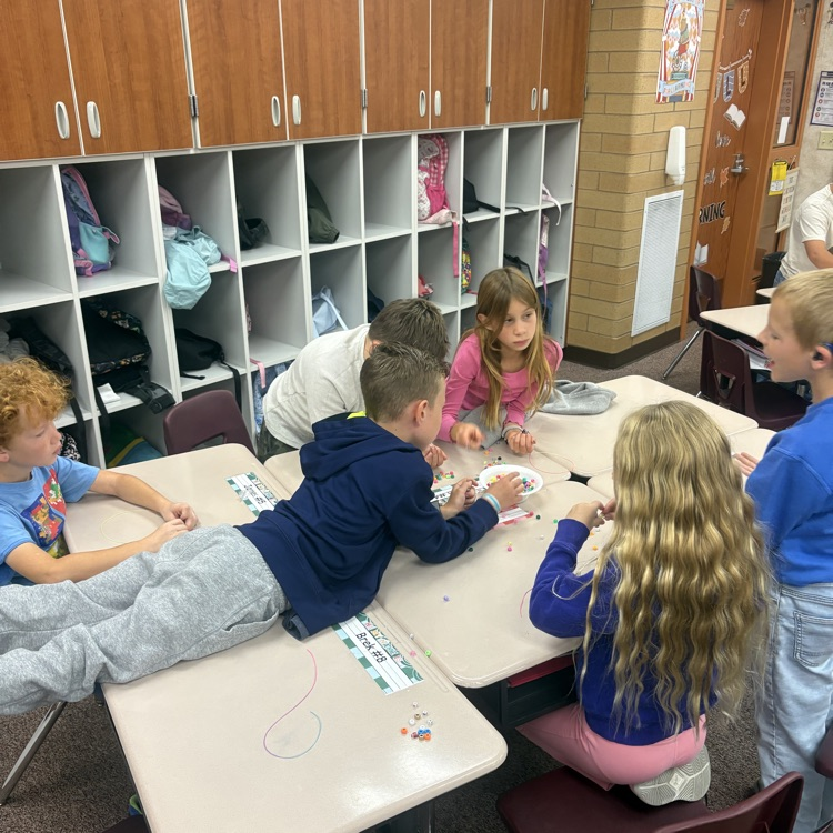 Mrs. Esplin’s class making friendship bracelets.