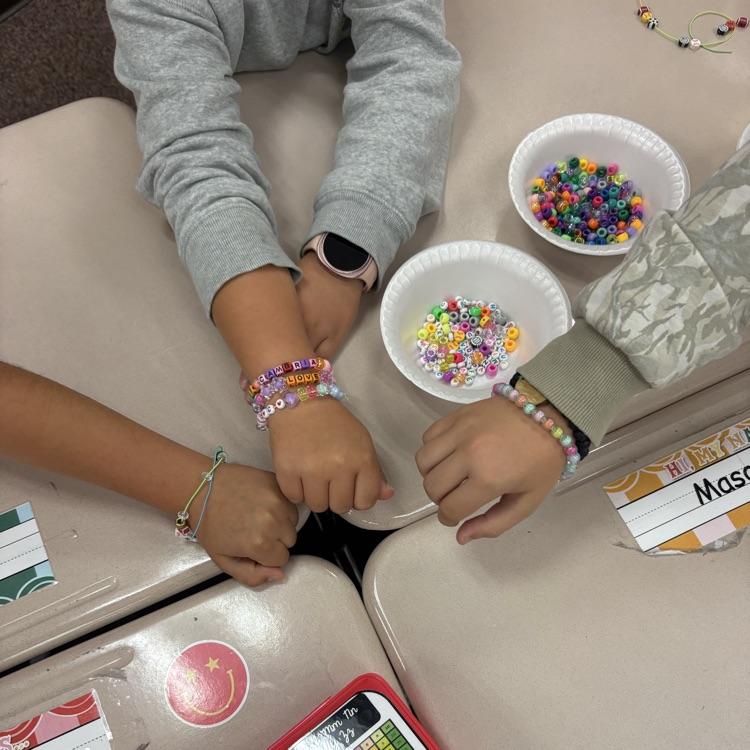 Mrs. Esplin’s class making friendship bracelets.