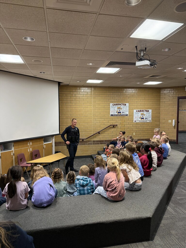 Officer Swenson teaching the Kindergarten about safety