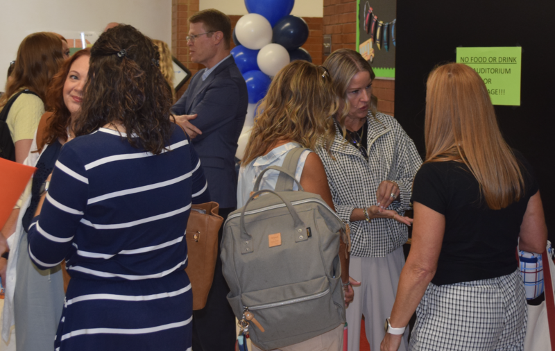 New Teachers Gathering in the halls