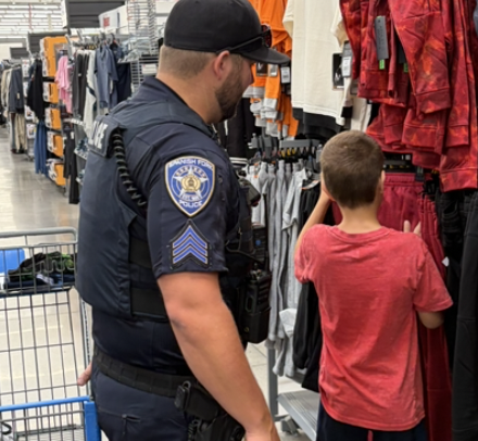 Cop shopping with kid