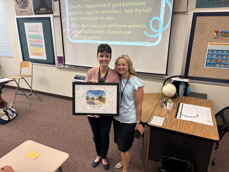 Faculty member receiving painting
