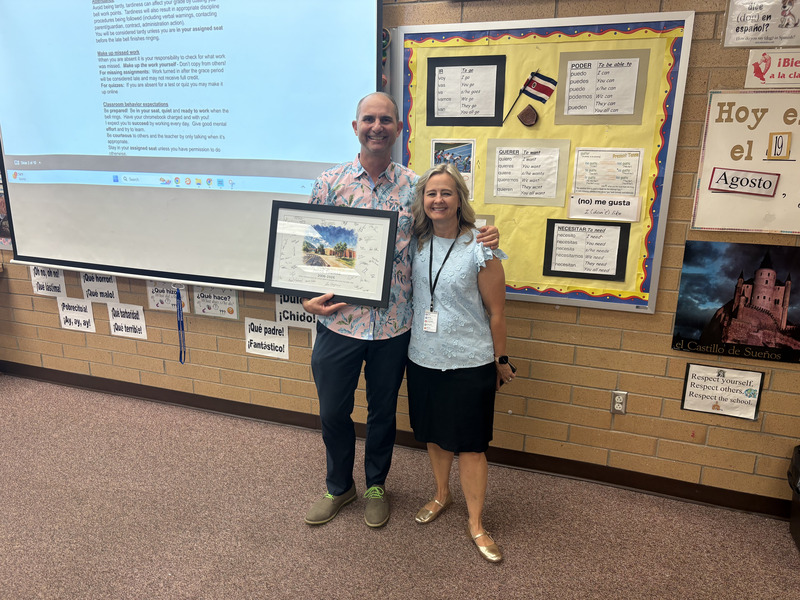 Faculty member receiving painting