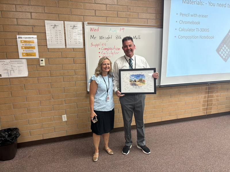 Faculty member receiving painting