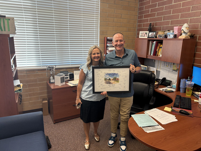 Faculty member receiving painting