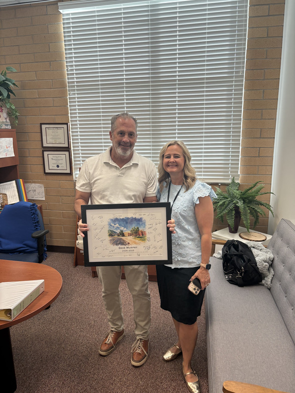 Faculty member receiving painting