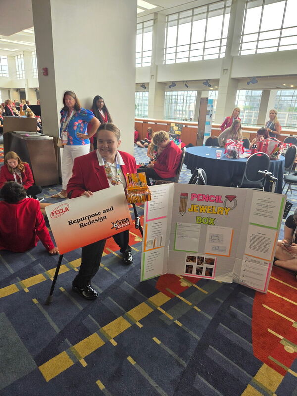 Cadence with her Repurpose and Redesign project and display.