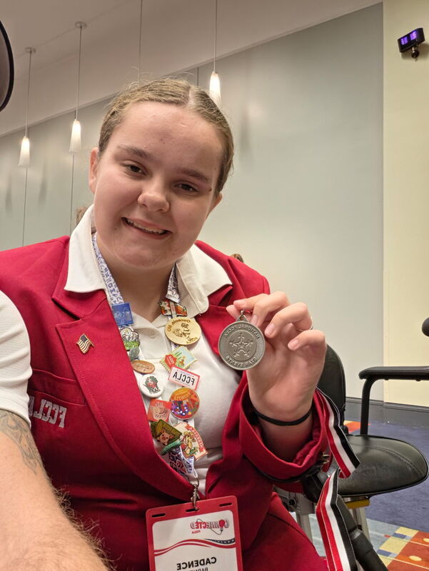 Cadence shows off the silver medal that she earned at the FCCLA National Leadership Conference.