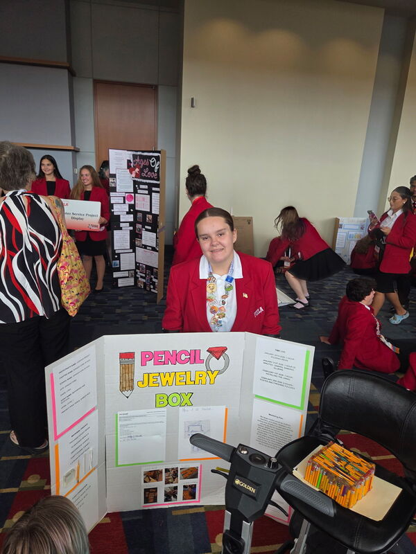 Cadence with her Repurpose and Redesign project and display.