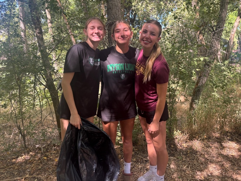 students cleaning trash