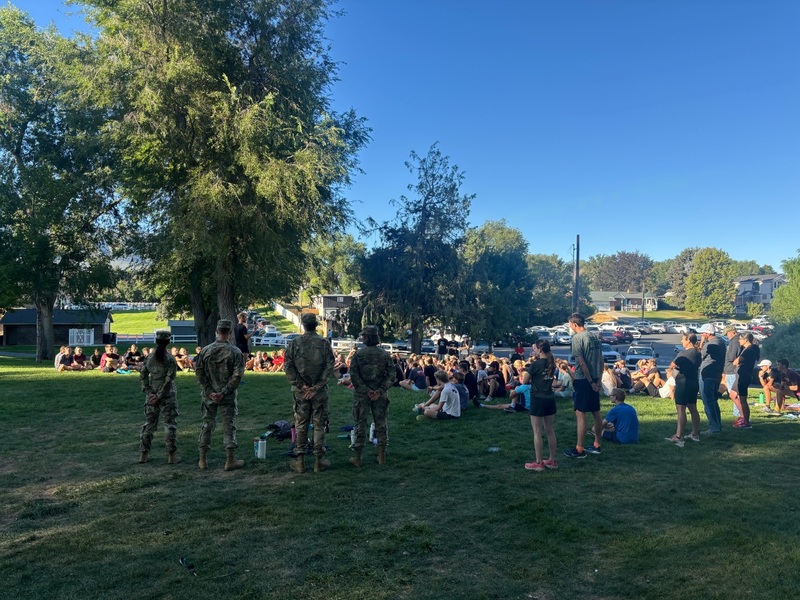 Student listening to national guard