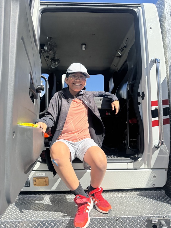 Student sitting in the back of the fire truck