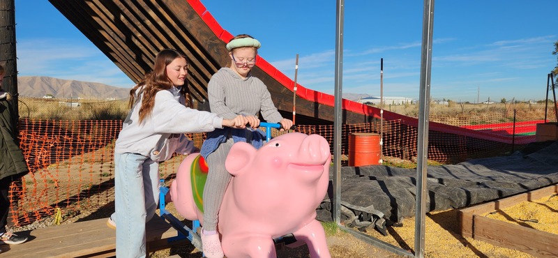 Student riding Pig