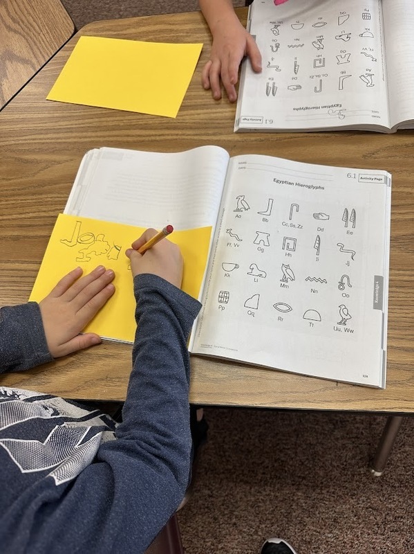 First grade practicing hieroglyphics 