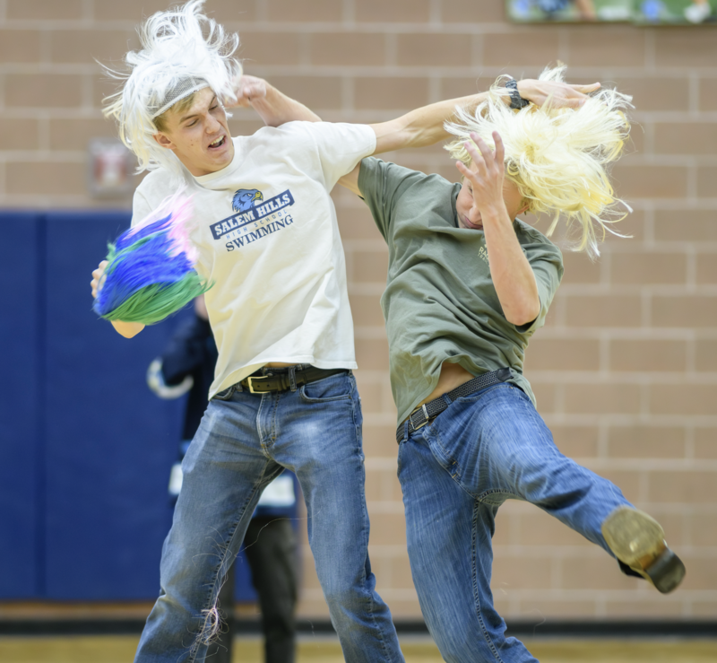 students playing snatch the wig in the make a wish assembly
