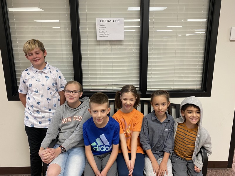 6 kids sitting on bench