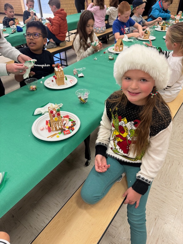 student making gingerbread houses