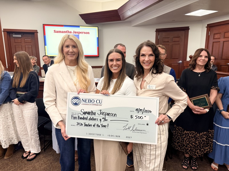 Samantha Jasperson with Cyprus Credit Union Check