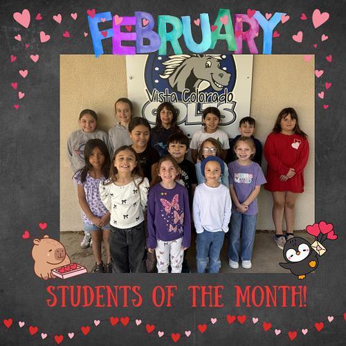 Febuary Students of the month standing in front of wall getting their picutre taken.