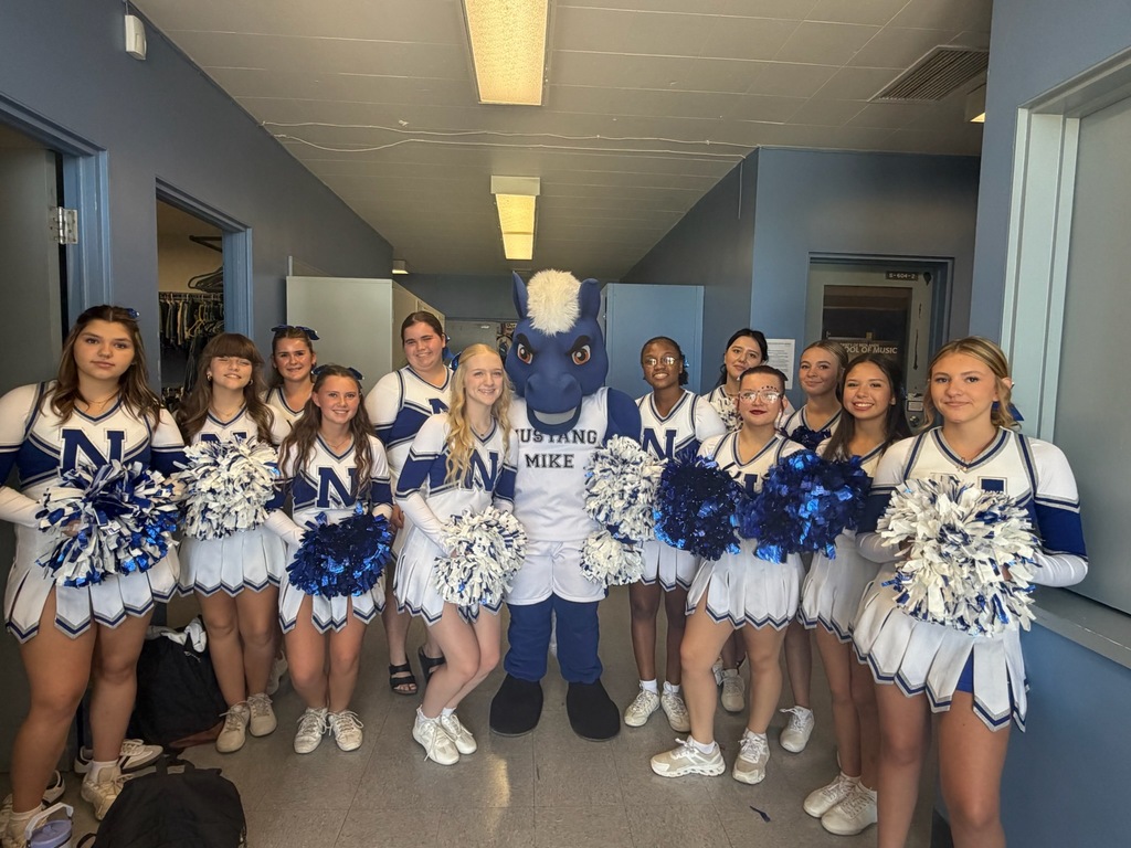 NHS Cheerleaders standing with blue horse mascot.