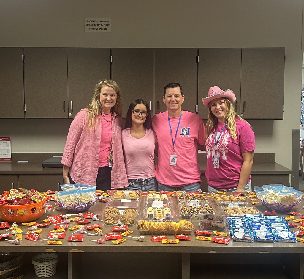 student and teachers in front of treats