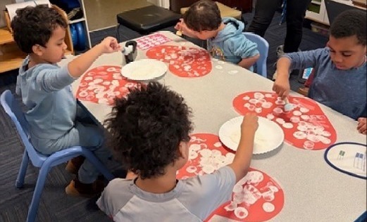 Students working on Valentines Day project