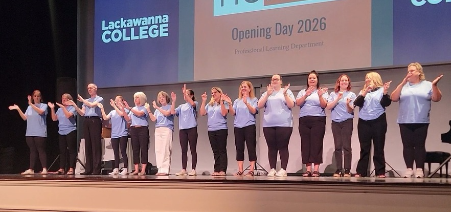Photo of NEIU staff on stage
