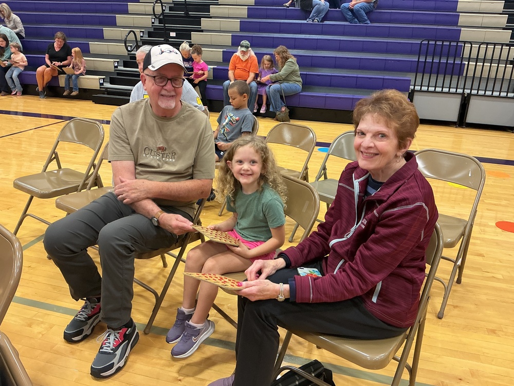 Maelee Piper and her grandparents enjoying the Grandfriends’ Day event at NCEMS.