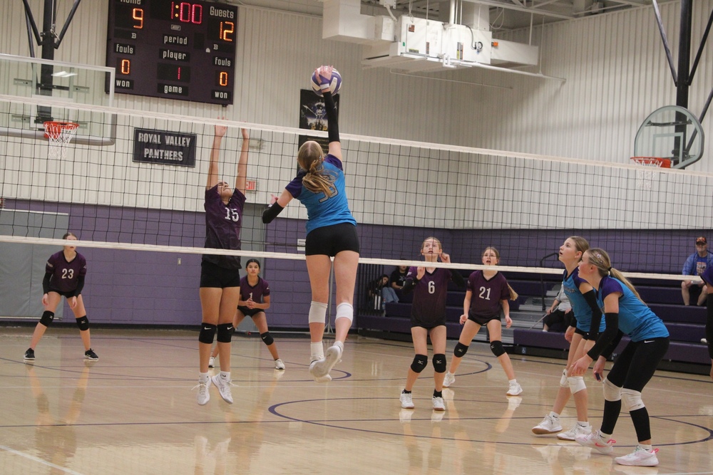 Sawyer Lutz spikes the ball.