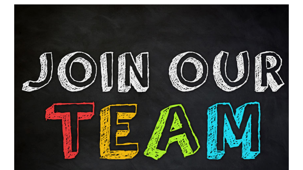 Chalkboard-style sign reading ‘JOIN OUR TEAM’ in large white and colorful hand-drawn letters on a black background.
