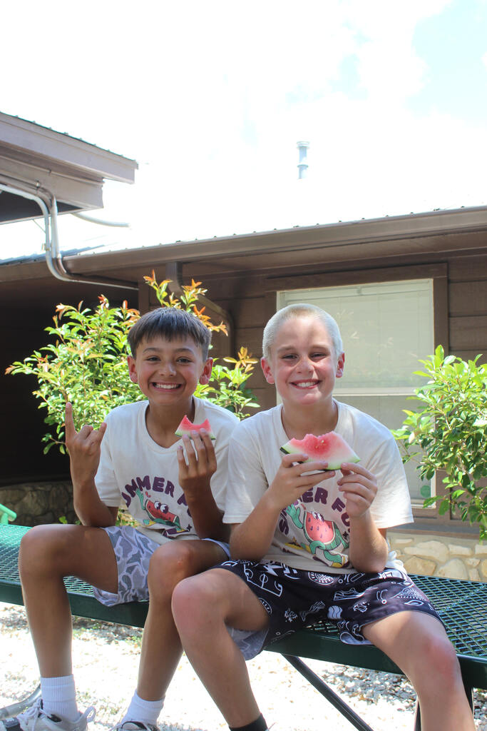boys eating watermelon
