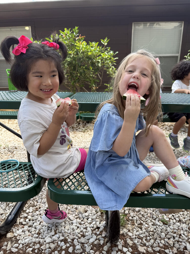 girls eating watermelon