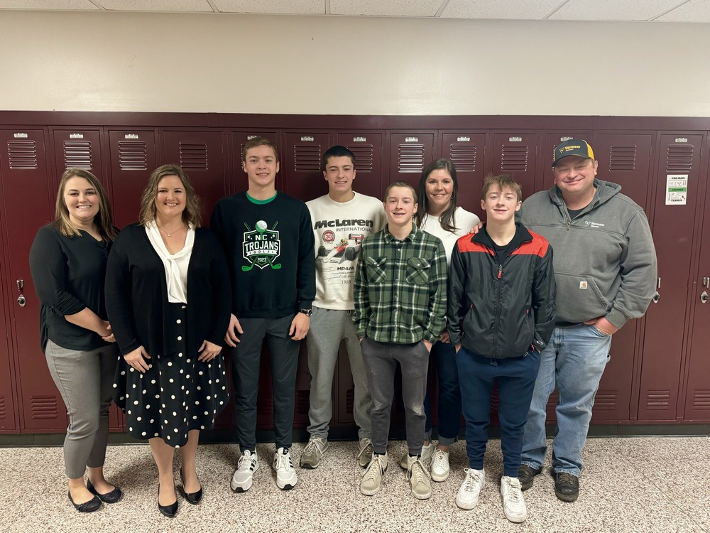 Wyatt Brewster with his family and school admins