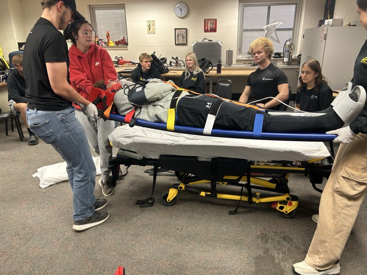 "Future EMTs in action! Practicing backboard skills today to perfect teamwork, communication, and patient care. Every drill brings us closer to saving lives. 🚑 #EMTTraining #FutureHeroes"