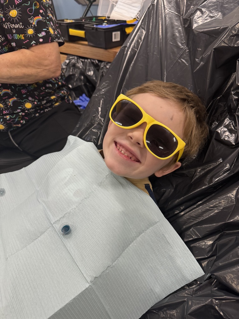 Sunglasses can't block those shiny teeth!