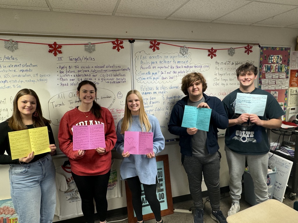 Students holding Hero Cards