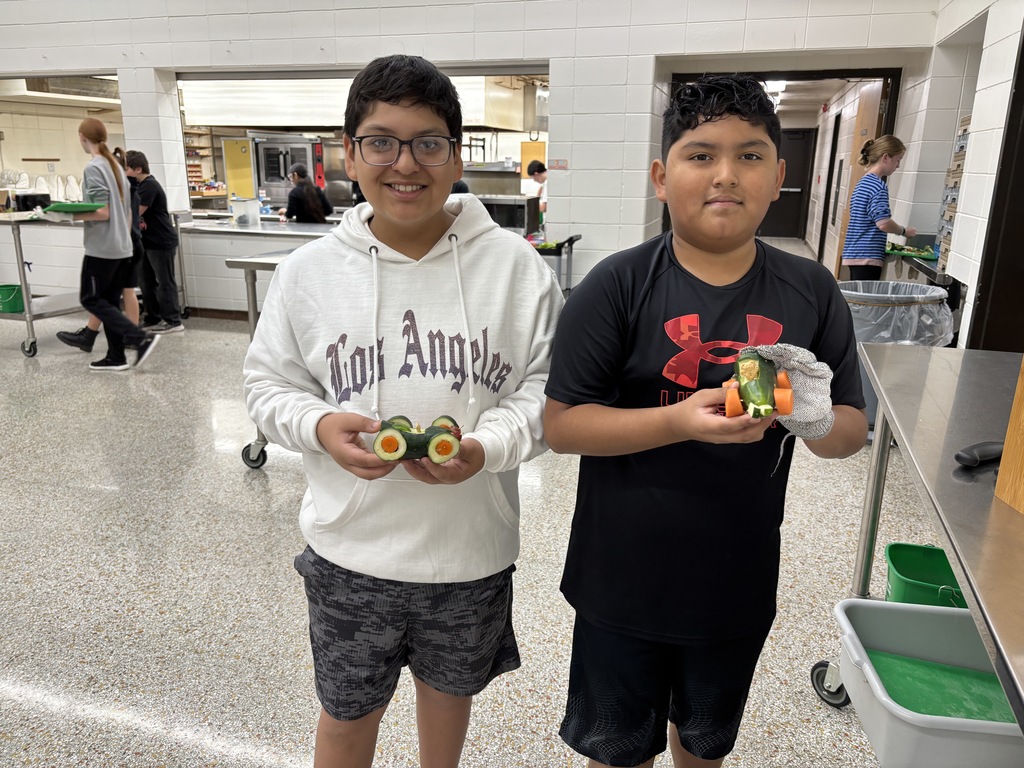 Wow! Mrs. Schmitt is so impressed by her Day One 7th Graders FCS students! They practiced knife skills today by cutting fruit and vegetables to make their individual cars. In a previous cWow! Mrs. Schmitt is so impressed by her Day One 7th Graders FCS students! They practiced knife skills today by cutting fruit and vegetables to make their individual cars. In a previous class they drew out their sketches and made a plan and a list of what they needed. Take a look at the pictures to see their success! lass they drew out their sketches and made a plan and a list of what they needed. Take a look at the pictures to see their success! 