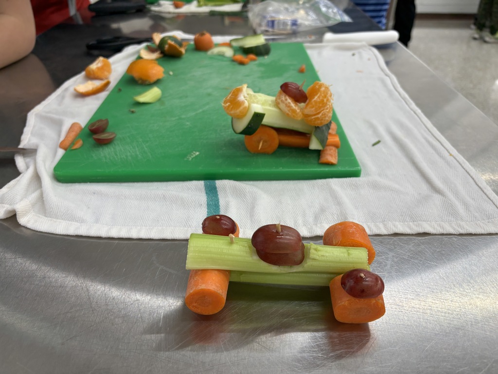 Wow! Mrs. Schmitt is so impressed by her Day One 7th Graders FCS students! They practiced knife skills today by cutting fruit and vegetables to make their individual cars. In a previous class they drew out their sketches and made a plan and a list of what they needed. Take a look at the pictures to see their success! 
