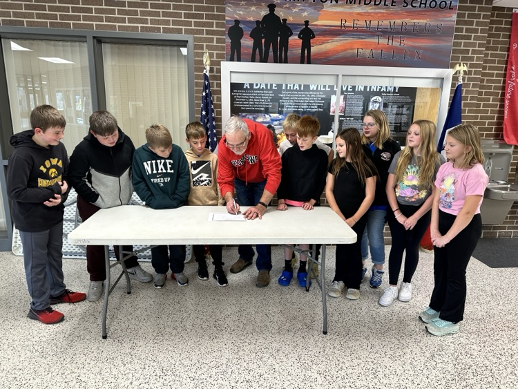 Mayor Geerts visited New Hampton Middle School to sign the American Education Week proclamation as students looked on.