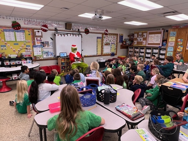 Second Grade had a special visitor this morning! The Grinch surprised us and read How The Grinch Stole Christmas. Everyone had a fun time!