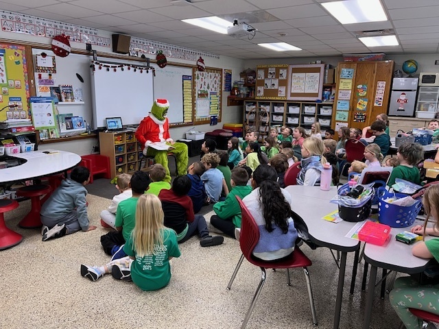 Second Grade had a special visitor this morning! The Grinch surprised us and read How The Grinch Stole Christmas. Everyone had a fun time!
