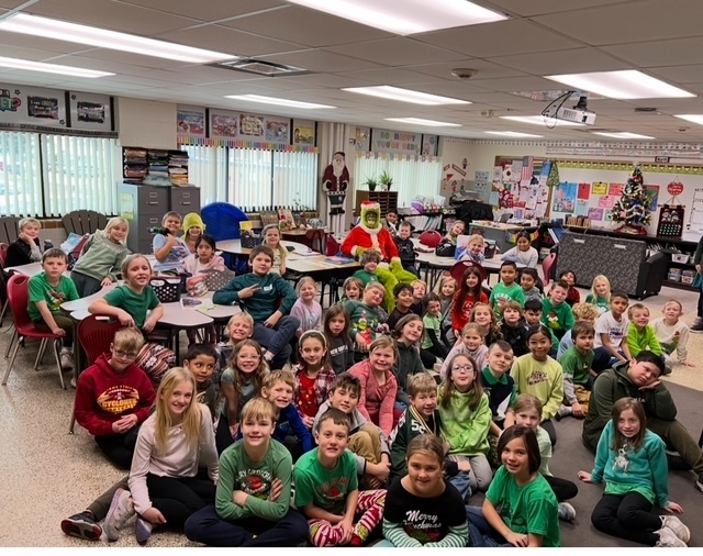 Second Grade had a special visitor this morning! The Grinch surprised us and read How The Grinch Stole Christmas. Everyone had a fun time!