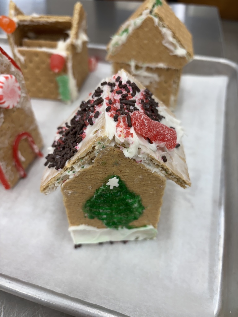 7th Grade FCS constructed "gingerbread" houses out of graham crackers in FCS class. Some imploded and were not successful. Please Vote ONLY by liking the picture. You have five to choose from. Thanks! 