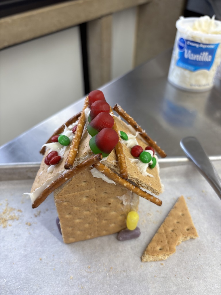 7th Grade FCS constructed "gingerbread" houses out of graham crackers in FCS class. Some imploded and were not successful. Please Vote ONLY by liking the picture. You have five to choose from. Thanks! 