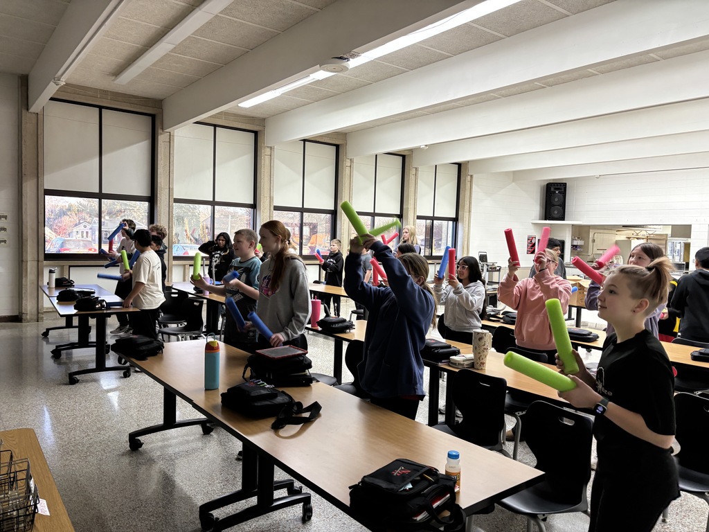 Being healthy is more than just eating nutritious food. The 7th grade FCS class enjoyed doing "Cardio Desk Drumming" with pool noodles and some rock'in music videos from a P.E. teacher. Also the students were laughing and having fun. Another important part to a healthy lifestyle. (the lights were off, so the pictures are a little dark.)
